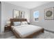 Light and airy bedroom with a wooden platform bed at 9847 Laurel Berry Dr, Orlando, FL 32827