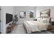 Bright bedroom featuring a king-size bed and large TV at 9847 Laurel Berry Dr, Orlando, FL 32827
