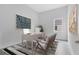 Bright home office features a large desk, comfortable chairs, and natural light at 9847 Laurel Berry Dr, Orlando, FL 32827