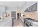 Modern kitchen features stainless steel appliances and a large island at 9847 Laurel Berry Dr, Orlando, FL 32827
