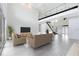 Open living space featuring modern furniture and a view of the entryway at 9847 Laurel Berry Dr, Orlando, FL 32827