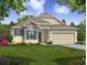 Attractive one-story home with stone accents and a two-car garage at Tbd Ensley Rd, Sorrento, FL 32776