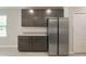 Kitchen with stainless steel refrigerator and dark cabinets at Tbd Ensley Rd, Sorrento, FL 32776