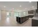 Open concept kitchen with large island and access to backyard at Tbd Ensley Rd, Sorrento, FL 32776