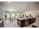 Open concept kitchen and dining area with an island and stainless steel appliances at Tbd Ensley Rd, Sorrento, FL 32776