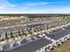 Aerial view of community with many townhouses at 1153 Seaside Mist Trl, Kissimmee, FL 34747