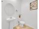 Small bathroom with pedestal sink and toilet at 1153 Seaside Mist Trl, Kissimmee, FL 34747