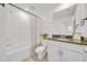 Clean bathroom with bathtub and granite vanity at 1153 Seaside Mist Trl, Kissimmee, FL 34747