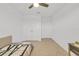 Well-lit bedroom featuring a twin bed and double doors at 1153 Seaside Mist Trl, Kissimmee, FL 34747