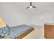 Cozy bedroom with a double bed and ceiling fan at 1153 Seaside Mist Trl, Kissimmee, FL 34747