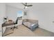 Bedroom with a daybed, workspace, and window at 1153 Seaside Mist Trl, Kissimmee, FL 34747