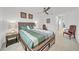 Spacious bedroom with a large bed, nightstands, and a ceiling fan at 1153 Seaside Mist Trl, Kissimmee, FL 34747