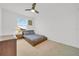 Well-lit bedroom with a double bed and nightstand at 1153 Seaside Mist Trl, Kissimmee, FL 34747
