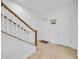 Clean and modern entryway with white doors and wood staircase at 1153 Seaside Mist Trl, Kissimmee, FL 34747