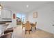 Bright kitchen nook with a round table and four chairs, overlooking the backyard at 1153 Seaside Mist Trl, Kissimmee, FL 34747