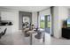 Bright dining area with table and chairs, view to backyard at 1328 Hanoverian Dr, Lake Alfred, FL 33850