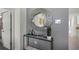 Stylish entryway with console table and decorative mirror at 1328 Hanoverian Dr, Lake Alfred, FL 33850