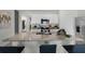 Kitchen island with granite countertop and seating for four at 1328 Hanoverian Dr, Lake Alfred, FL 33850