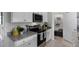 White cabinets, granite countertops, and stainless steel appliances at 1328 Hanoverian Dr, Lake Alfred, FL 33850