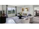 Spacious living room with sectional sofa and large window at 1328 Hanoverian Dr, Lake Alfred, FL 33850