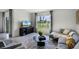 Comfortable living room featuring sectional sofa and coffee table at 1328 Hanoverian Dr, Lake Alfred, FL 33850