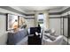 Home office with desk, chairs, and plenty of natural light at 1328 Hanoverian Dr, Lake Alfred, FL 33850