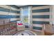 Adorable Bedroom with crib and nautical-themed decor at 1332 Hanoverian Dr, Lake Alfred, FL 33850