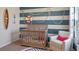 Adorable Bedroom features a crib, armchair, and nautical-themed wall decor at 1332 Hanoverian Dr, Lake Alfred, FL 33850