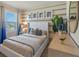 Guest bedroom with a queen bed and coastal-themed decor at 1332 Hanoverian Dr, Lake Alfred, FL 33850