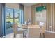 Breakfast nook with a round table and ocean-themed decor at 1332 Hanoverian Dr, Lake Alfred, FL 33850