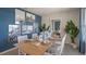 Coastal-themed dining room with a wood table and artwork at 1332 Hanoverian Dr, Lake Alfred, FL 33850