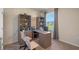 Home office with large desk and built-in shelving at 1332 Hanoverian Dr, Lake Alfred, FL 33850