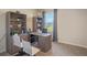 Bright home office with L-shaped desk and two chairs at 1332 Hanoverian Dr, Lake Alfred, FL 33850