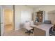 Spacious home office with built-in shelving and desk at 1332 Hanoverian Dr, Lake Alfred, FL 33850