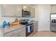 Kitchen with granite countertops and stainless steel appliances at 1332 Hanoverian Dr, Lake Alfred, FL 33850