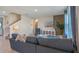 Spacious living room featuring a sectional sofa and natural light at 1332 Hanoverian Dr, Lake Alfred, FL 33850