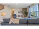 Bright living room with comfy sectional sofa and large window at 1332 Hanoverian Dr, Lake Alfred, FL 33850