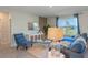 Living room with a sectional sofa and a large window at 1332 Hanoverian Dr, Lake Alfred, FL 33850