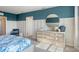 Bright bedroom with a dresser and ensuite bathroom access at 1332 Hanoverian Dr, Lake Alfred, FL 33850