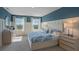Relaxing main bedroom with a king-size bed and water view at 1332 Hanoverian Dr, Lake Alfred, FL 33850