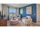 Bright sitting room with two armchairs and a large window at 1332 Hanoverian Dr, Lake Alfred, FL 33850