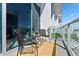 Cozy balcony features seating, a small table, and views of the city at 150 E Robinson St # 1011, Orlando, FL 32801