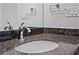 Bathroom features a stone countertop with a white basin at 150 E Robinson St # 1011, Orlando, FL 32801