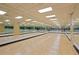Spacious dance studio featuring mirrored walls and hardwood floors at 150 E Robinson St # 1011, Orlando, FL 32801