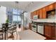 Open living room with high ceilings, spiral staircase, modern kitchen and floor-to-ceiling windows with a view at 150 E Robinson St # 1011, Orlando, FL 32801