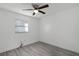 Spacious bedroom with wood-look flooring and ceiling fan at 1527 Hernandes Dr, Orlando, FL 32808