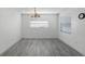 Simple dining room with gray flooring and neutral walls at 1527 Hernandes Dr, Orlando, FL 32808