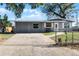 Charming single-story home with a paved driveway at 1527 Hernandes Dr, Orlando, FL 32808