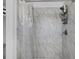 Clean shower stall with marble tile surround and a shower curtain at 1527 Hernandes Dr, Orlando, FL 32808