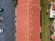 Top-down aerial shot of the community's terracotta roof, bordered by visitor parking and green spaces at 1606 Sandy Point Sq # 53, Orlando, FL 32807
